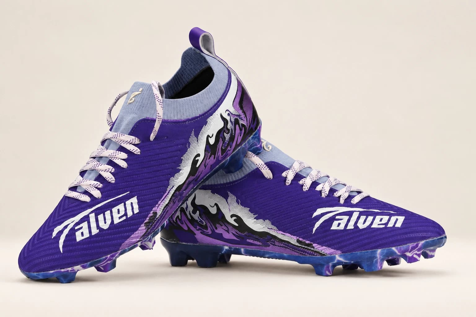 A pair of Stravion Purple boots angled to show the Talven wordmark on the forefoot.