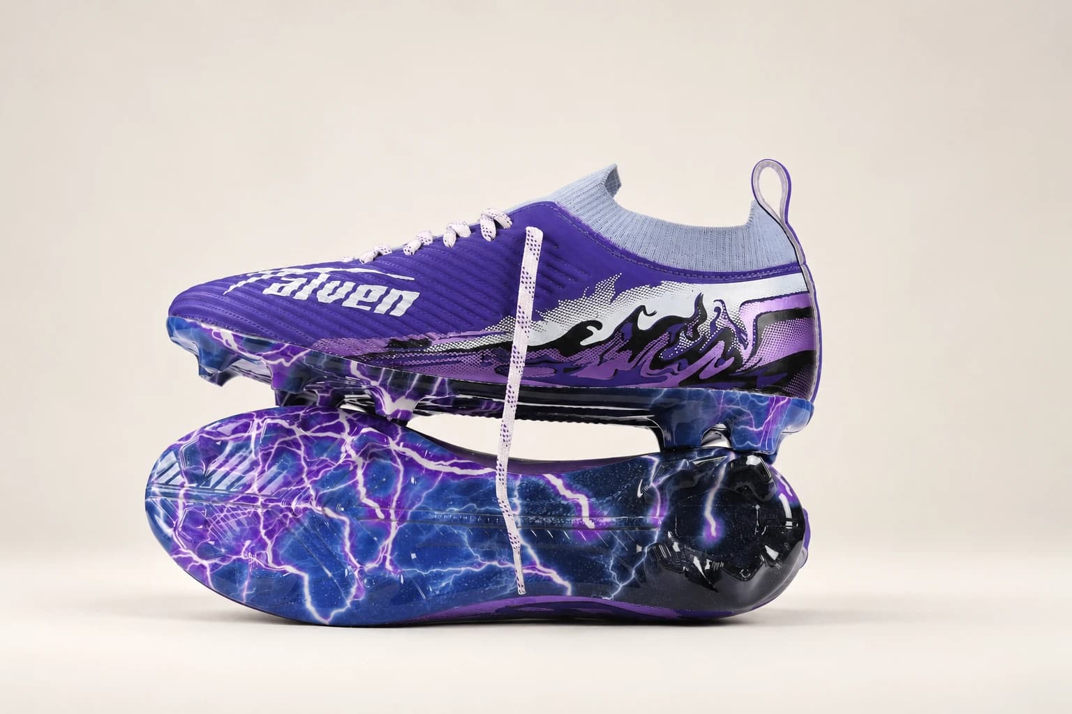 Two Stravion Purple boots stacked, one showing the lightning-print outsole.