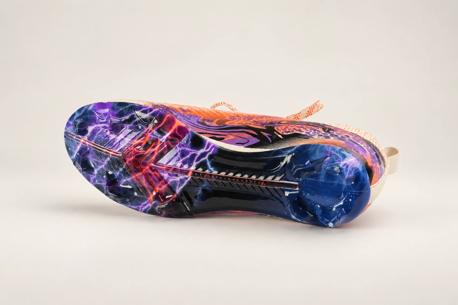 The Stravion White lightning-print outsole in purple, blue and orange.